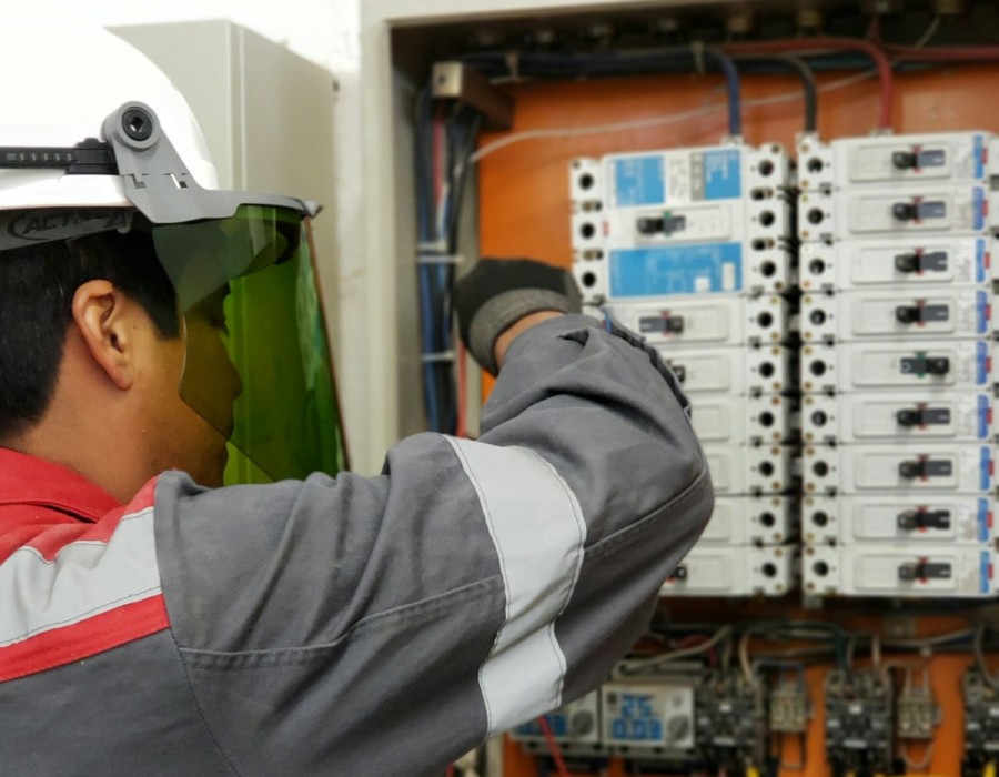 WIN-TEC Electrical Engineer inspecting control panel